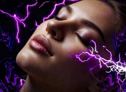 Woman with eyes closed surrounded by purple energy